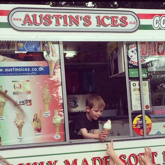Birthday boy serving an ice cream from the Austins Ices van hatch