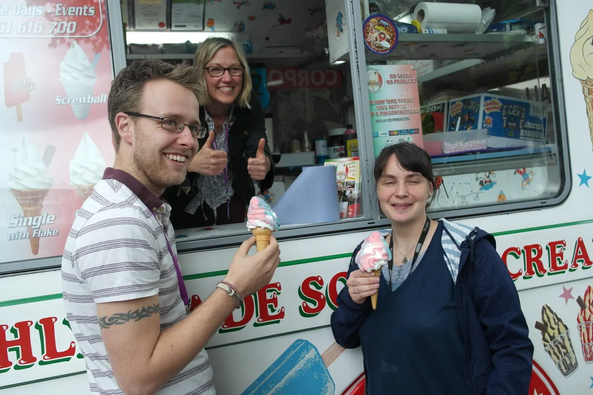 Smiling guests holding ice creams at the Austins Ices van