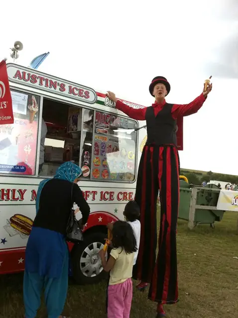 Stilt walker and ice creams at a family fun day
